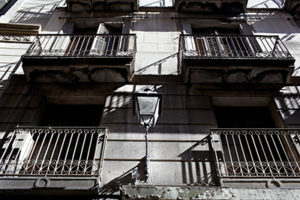 The house wall with a street lamp in Barcelona.